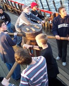 Students work the capstan.