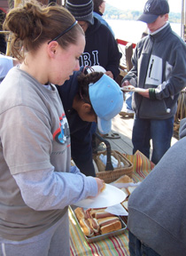 Students line up for hot dogs at lunch.