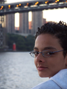 Amro looks out over the water, with the George Washington Bridge in the background.