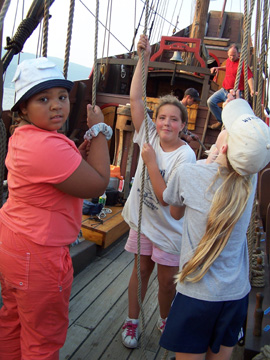 Madena, Ericka, and Kathleen train to work the main mast.