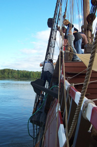 The fore deck crew prepares to set the port side anchor on its fore channel.