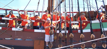Our orange-clad crew gathers on the weather deck.