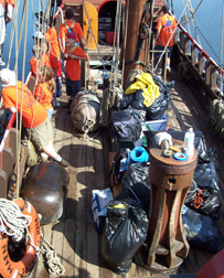 Piles of the crew's bagged gear covers half the weather deck.