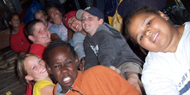 The first leg's student crew work together on the orlop deck.
