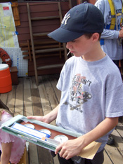 Kyle examines a barometer.