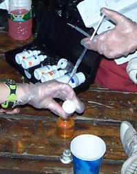 A closeup view of a titration kit and test in action.