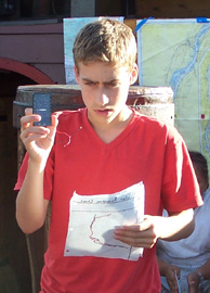 Adam shows off the solar cell he used to gather data for his report.