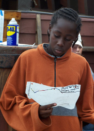 Richard checks his graph of Athens Channel's tidal pattern.