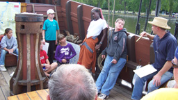 The starboard watch takes a question from Captain Reynolds at the end of their presentation.