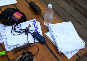 Various tools and instruments are scattered around Riki's avian illustrations on the aft hatch.