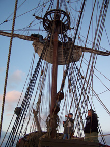 Mr. Morel and Mr. Dawson furl the fore course.