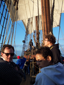 The crew looks on as both courses take wind.