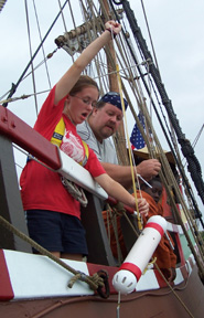 Katie retrieves the Van Dorn sampler as Mr. Prime looks on.