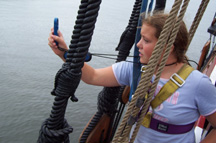 Ericka uses an anemometer to measure wind speed.