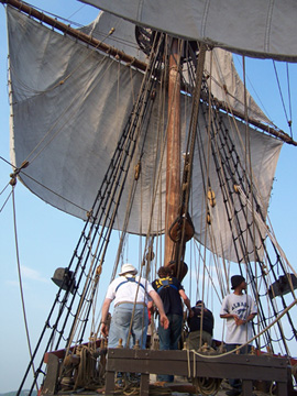 The foredeck crew monitors the lines as the foresails take wind.