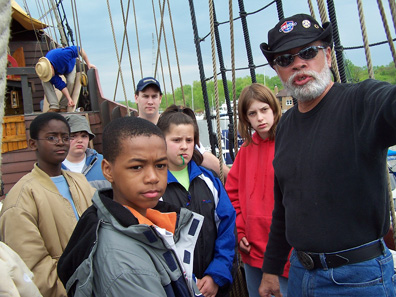 Captain Washington leads the students through a tour of the ship.