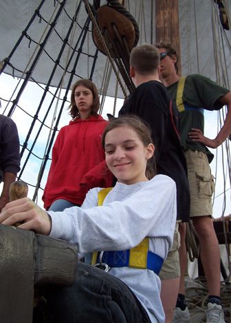 The foremast crew sets the fore course.