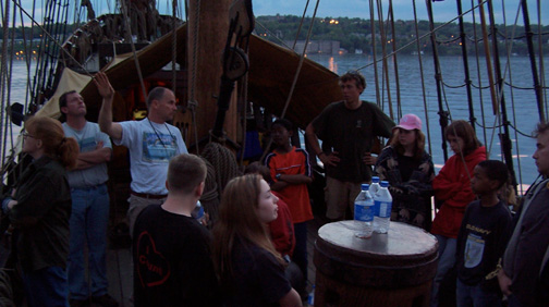 Captain Reynolds explains the oncoming storm clouds at dusk.
