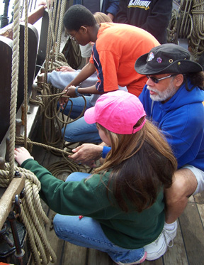 Captain Washington shows the students how to coil lines correctly.