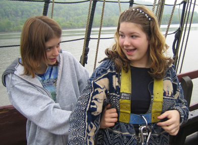 Sam helps Ginny into her safety harness.