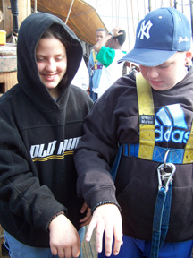 Veronica and Bryan show off their bracelets.