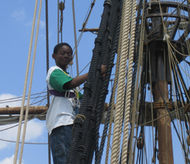 Jamar climbs the rig with a smile.