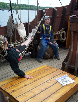 Dylan swings Andi on the hammock.