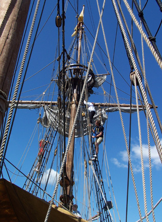 Captain Berg climbs the fore rigging with Andi and Daymien.