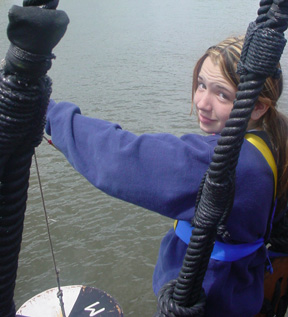 Kiera uses a Secchi disk to measure water clarity.