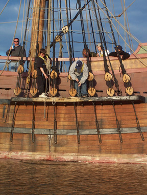 Daymien takes a sounding of the water depth while Bryan uses the Secchi disk next to him on the channel.