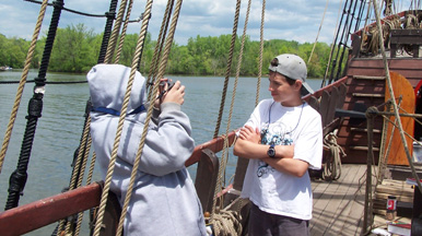 Bryan takes Dylan's photo on the weather deck.