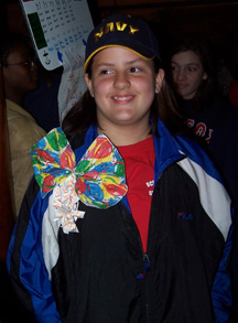 Veronica smiles while wearing a