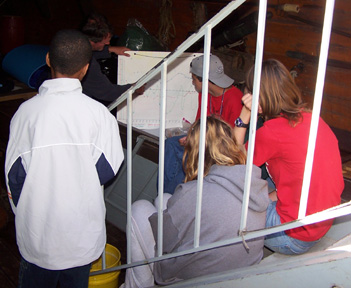 Mr. Linehan examines the graph the weather team has prepared.