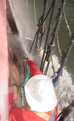 Mr. Weisse hoses off the anchor on the channel.