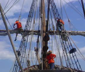 Captain Berg and Mr. Dawson perch on the foreyard while Ms. Farrel stands lookout.