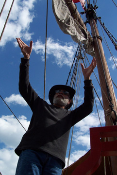 Captain Washington seems to command the heavens as he guides students handling the sails.