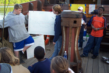 Bryan and Kiera step forward to discuss their findings.