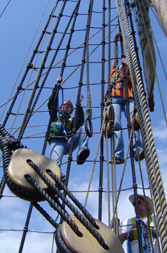 Kiera and Samantha prepare to climb the shrouds.