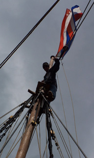 A closeup of Mr. Dawson perched atop the main mast.