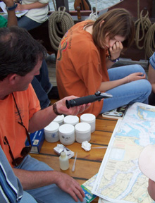 Mr. Linehan shows a refractometer to Samantha.