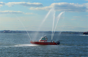 An N.Y.F.D. fireboat offers us a water display.