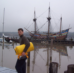 New crew member Keith Maurer is directed down the dock, with the Half Moon in the background.