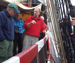 Captain Reynolds instructs new arrivals how to safely cross the main channel.