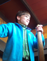 Alexander puts some elbow grease into mastering the whipstaff.