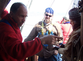 Captain Reybolds directs members of the senior crew.