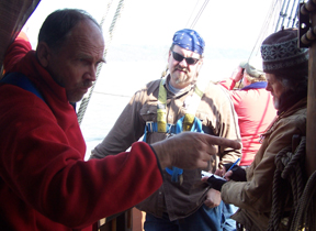 Captain Reybolds directs members of the senior crew.