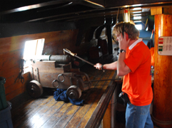 Mr. Gorter fires the starboard falconette.