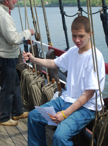 Muhammad uses a sling psychrometer to measure relative humidity.