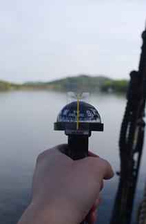 Peering over a hand-bearing compass at the southern end of Athens Channel.