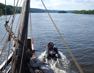 The Zodiac zips upriver, ahead of the ship. 